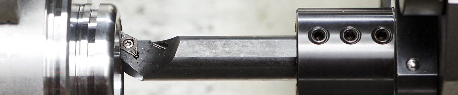 Boring bar machining a part on a CNC lathe