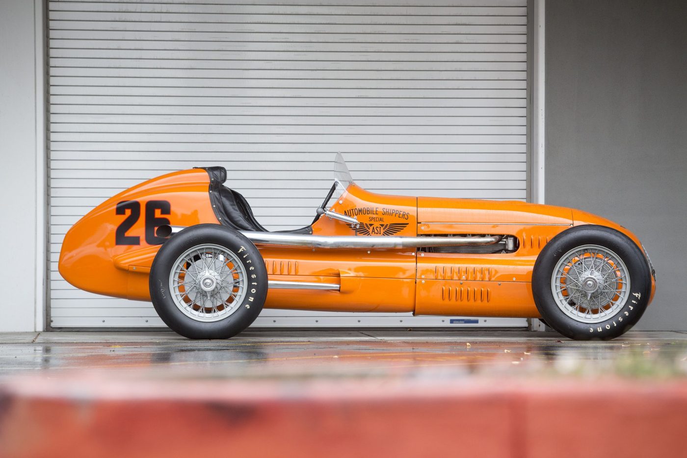 Side view of the restored orange No. 26 Automobile Shippers Special